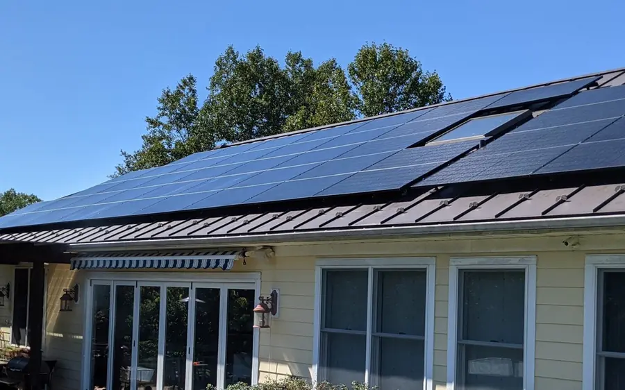 All black solar electric modules on the standing seam metal roof of a Florida home, installed by AllSolar Energy.